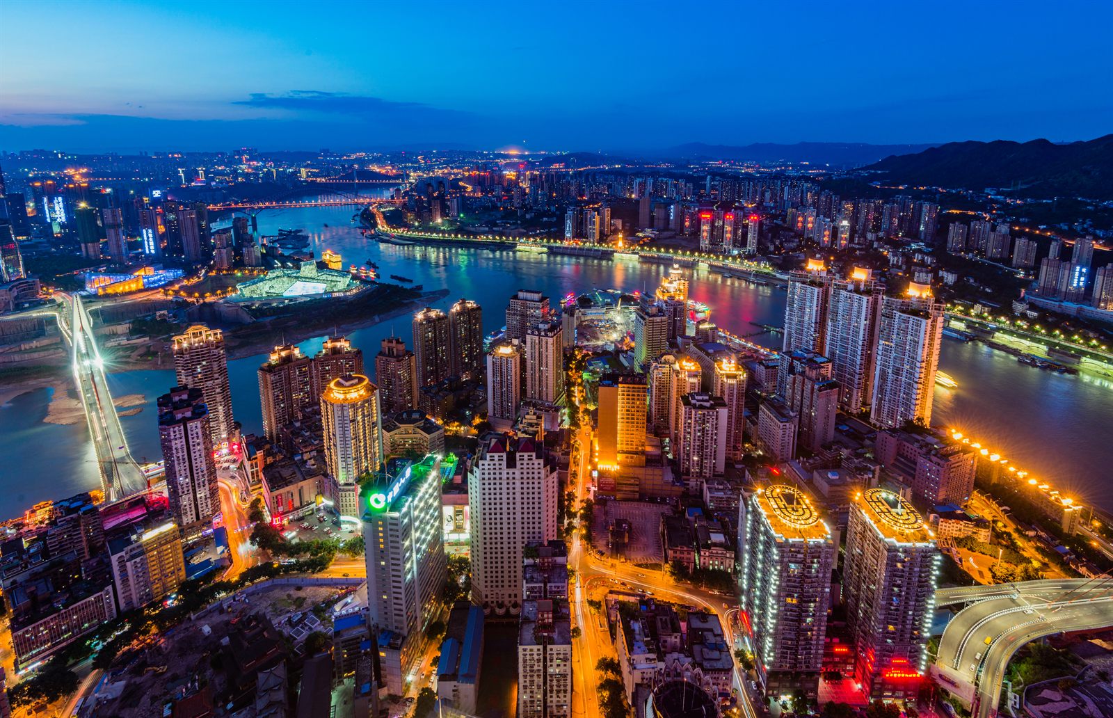 Chongqing skyline lit up at night above the Yangtze, the start of many Asia river cruising itineraries in China